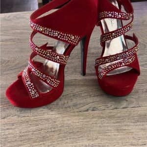 These stunning bright red velvet heels with hand placed iridescent crystals.